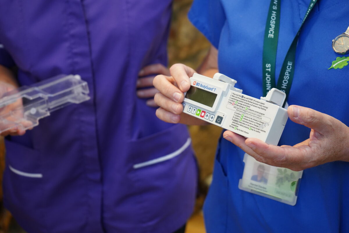 Close up of St John's Hospice nurses holding a syringe driver